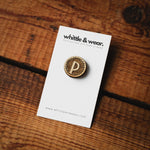 'P' with a crimped edge